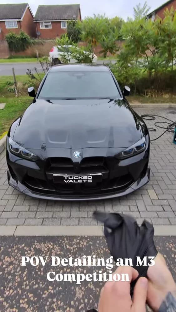 BMW M3 Competition on its weekly maintenance clean